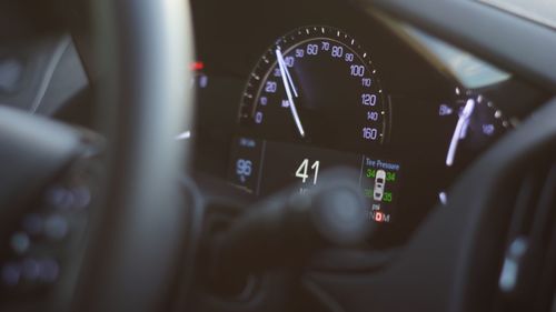 Close-up of speedometer in car