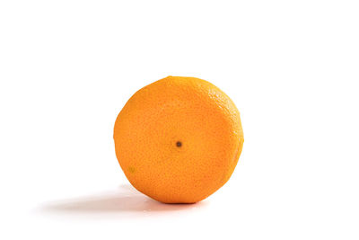 Close-up of orange fruit against white background