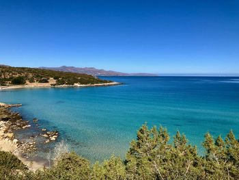 Scenic view of sea against clear blue sky