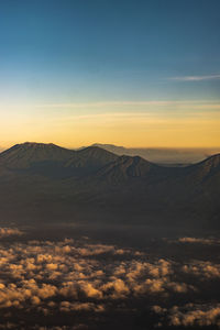 Scenic view of mountains against sky during sunset