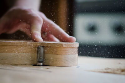 Close-up of shaping a guitar