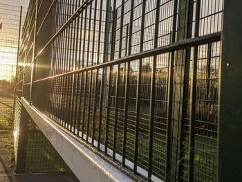 Metal railing seen through glass window