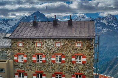 Houses in town against sky