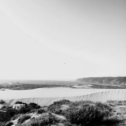 Scenic view of calm sea against clear sky