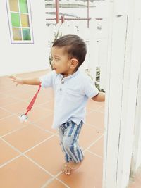 Boy playing in corridor