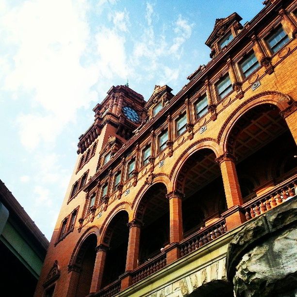 architecture, built structure, building exterior, arch, low angle view, sky, city, connection, history, window, bridge - man made structure, building, travel destinations, cloud - sky, railing, outdoors, day, cloud, no people, travel