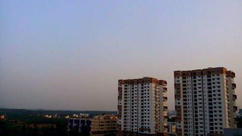 Buildings against clear sky