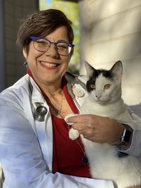 Portrait of woman with cat