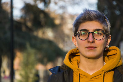 Young adult woman portrait at sunset in the park, tbilisi, georgia