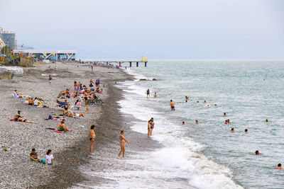  black sea beach in batumi, georgia. people during holidays and vacation. seascape and waves. 