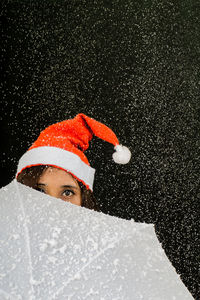 Portrait of young woman in snow