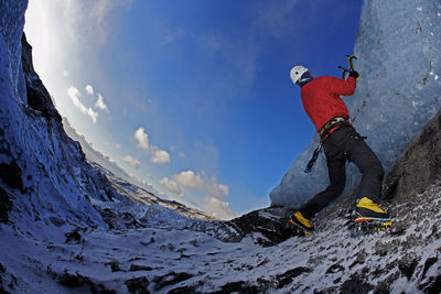 Mature man climbing at solheimajokull in south iceland