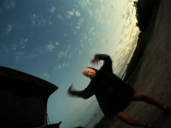 Close-up of woman against sky