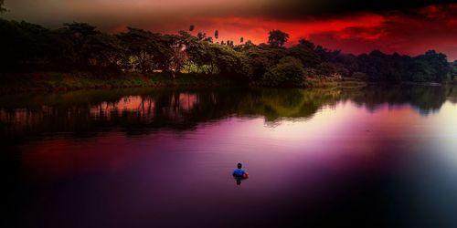 Scenic view of lake against sky during sunset