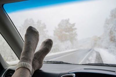 Man seen through car window