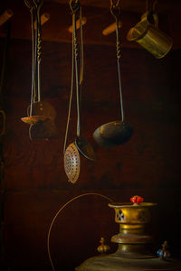 Close-up of electric lamp hanging in temple