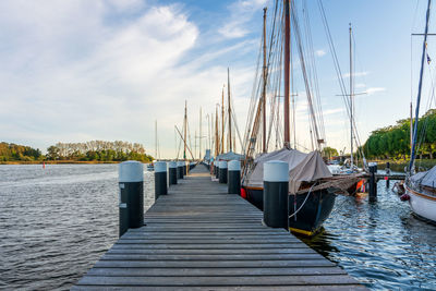 Boats moored at harbor