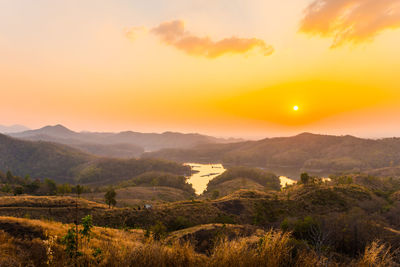 Scenic view of landscape against sky during sunset