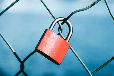 Padlock in a metal fence