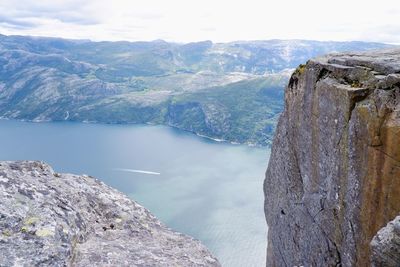 Scenic view of rocks and mountains against sky