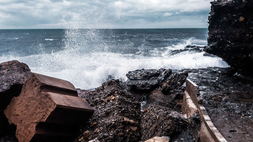 Sea waves splashing on rocks
