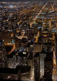 High angle view of illuminated cityscape at night