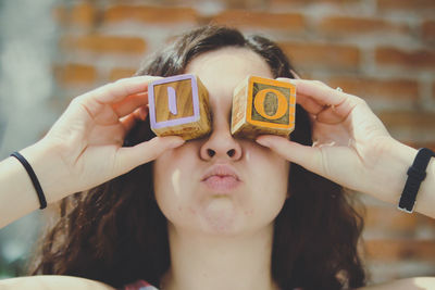 Close-up of girl holding toy blocks