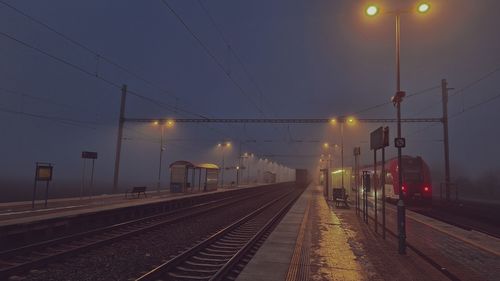 Night train in the fog. station in fog and darkness. passage of express train in fog and darkness