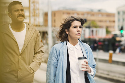 Man and woman at tram station