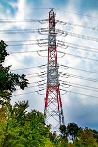 Low angle view of electricity pylon against sky