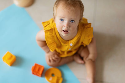 Portrait of cute baby toy at home