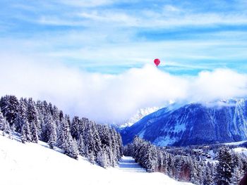 Scenic view of snow covered mountains