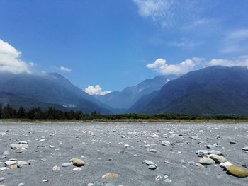 Scenic view of lake and mountains against sky