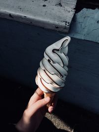 Close-up of hand holding ice cream 