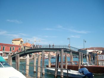 View of harbor against blue sky