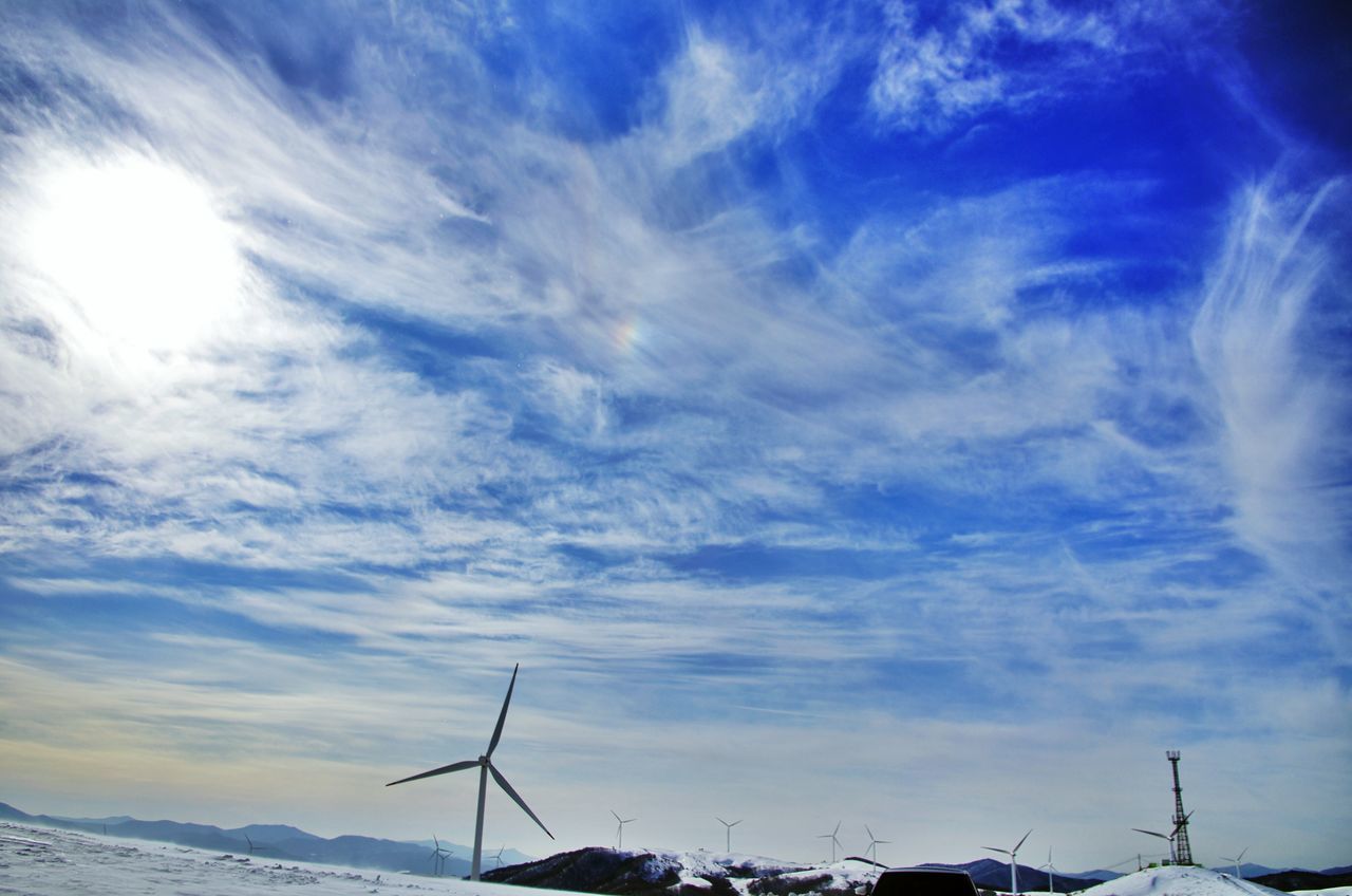 sky, cloud - sky, low angle view, tranquility, fuel and power generation, beauty in nature, cloud, nature, scenics, tranquil scene, cloudy, landscape, weather, electricity pylon, blue, power line, electricity, outdoors, sunlight, no people