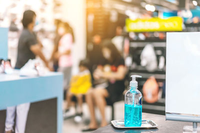 Close-up of people on table