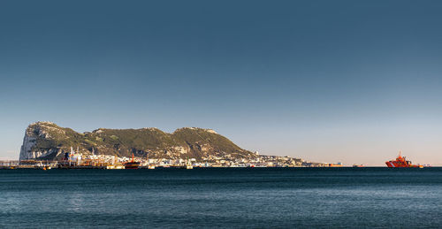 Scenic view of sea against clear blue sky