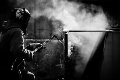 Worker welding metal