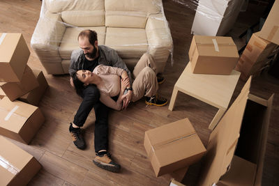 Low section of woman using mobile phone