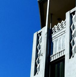 Low angle view of building against clear blue sky