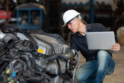 Man working with mobile phone in bus