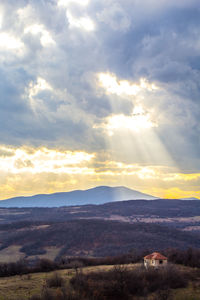 Scenic view of mountains against sky during sunset