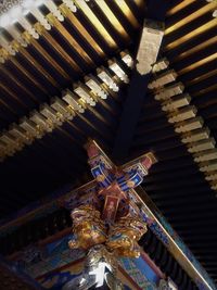 Low angle view of illuminated ceiling of building