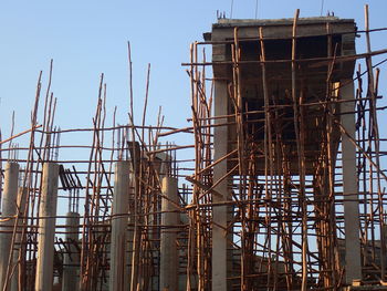 Low angle view of construction site against sky