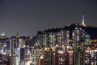 Illuminated buildings in city at night