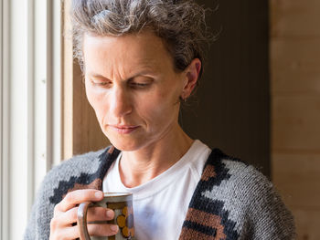 Close-up of mature man drinking glass