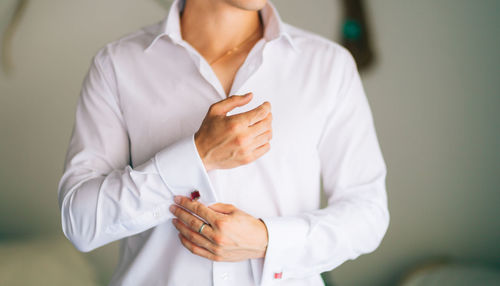 Midsection of woman holding hands