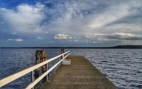 Pier over sea against sky