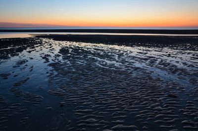 Scenic view of beach during sunset